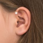 Girl with forward helix piercing