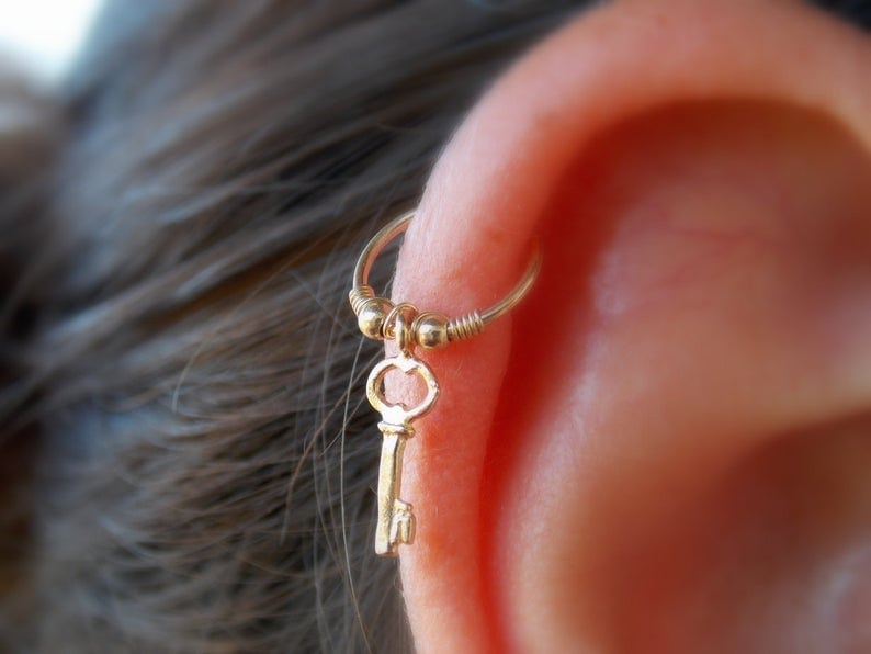 ear with helix piercing closeup
