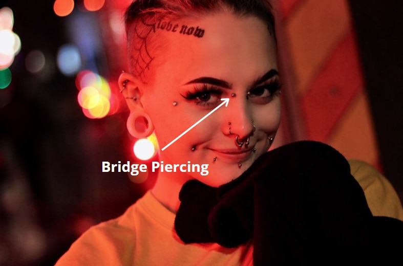 Girl wearing bridge piercing