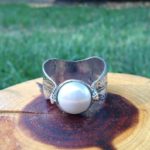 Pearl nestled leaf ring design