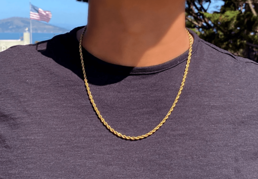 gold chain on mans neck