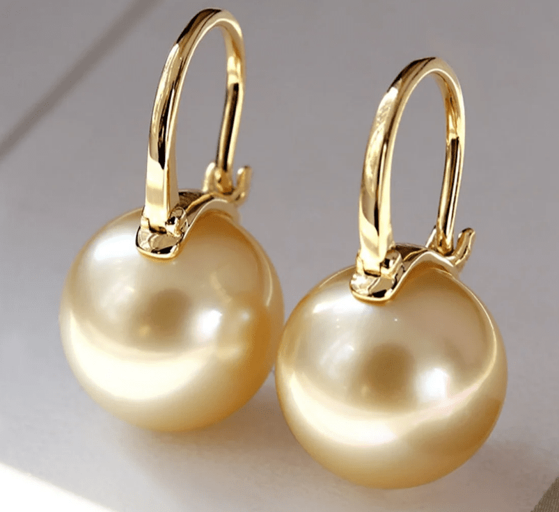 golden south sea earrings in gold setting
