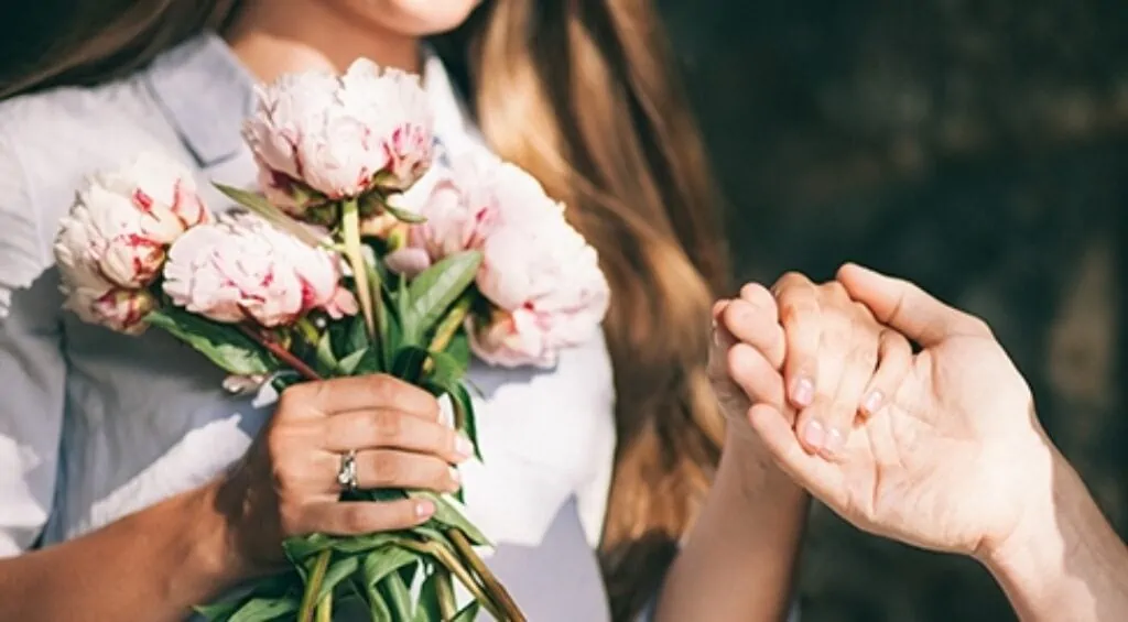 Girl holding her mother's hand