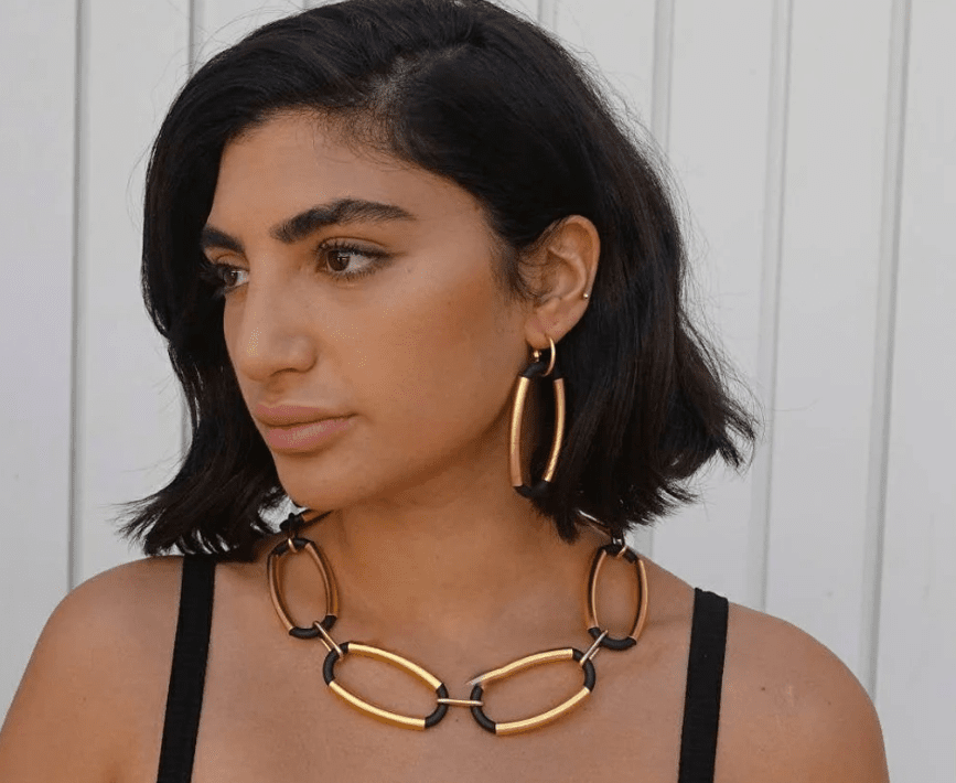 girl with statement necklace and earrings