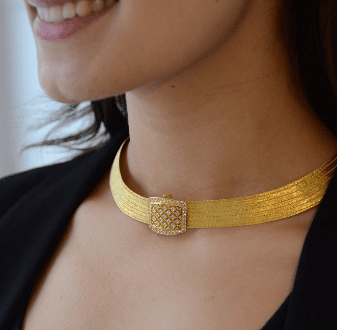 girl wearing gold choker necklace