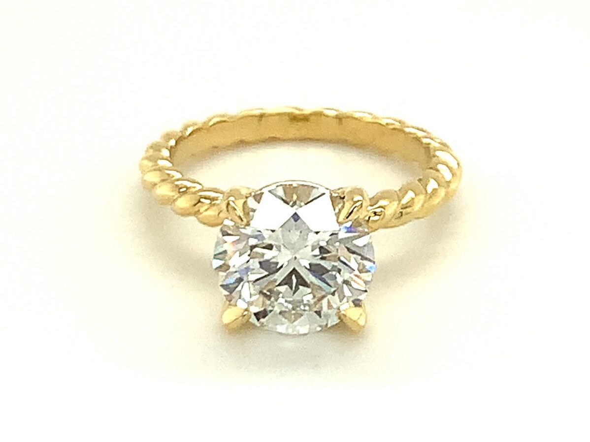 braided gold diamond ring