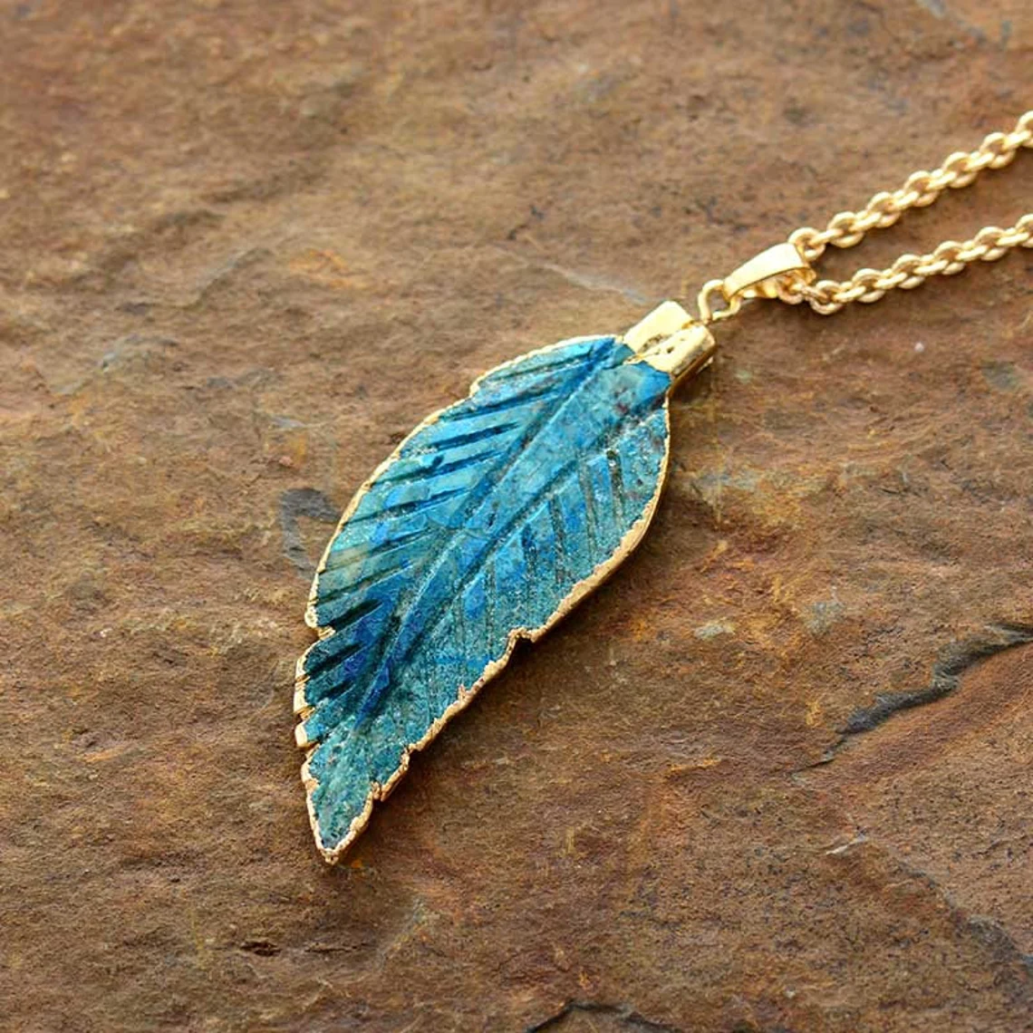 bo leaf pendant in gold and blue