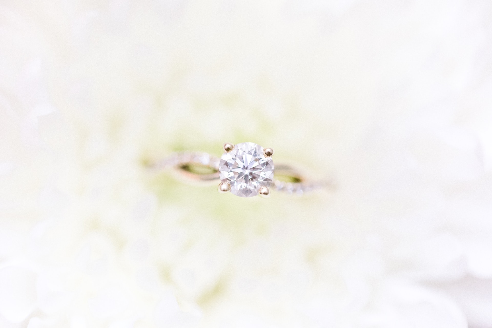 moissanite ring in floral background