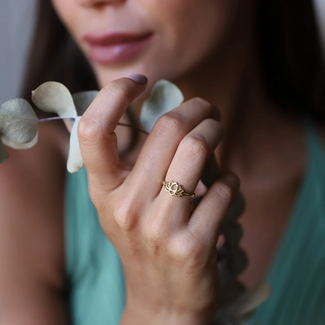 lotus ring on woman's finger
