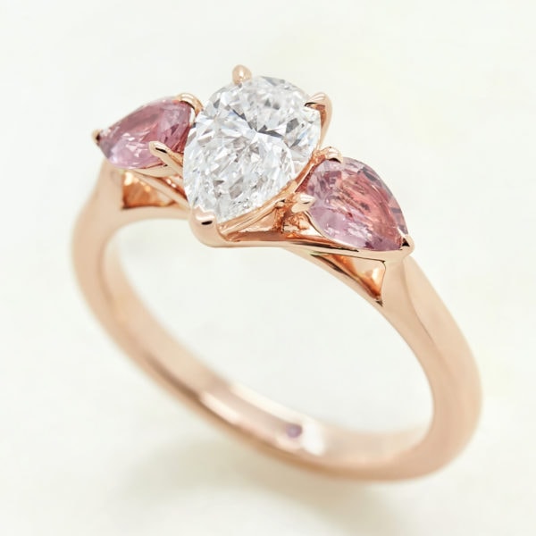 pear diamond rose gold trilogy engagement ring