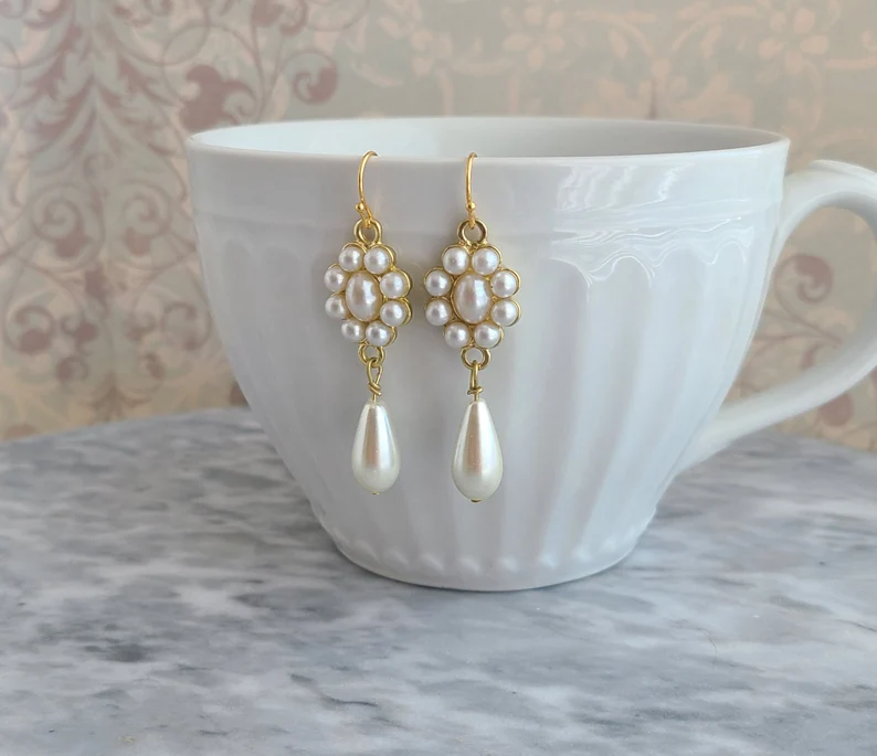 18th century pearl earrings hooked on a cup
