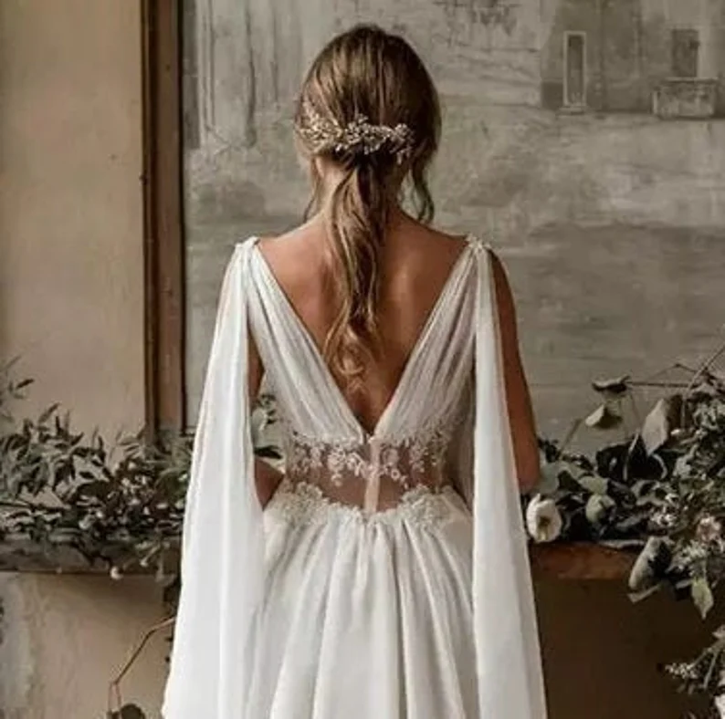 back view of a woman wearing ancient greek wedding dress