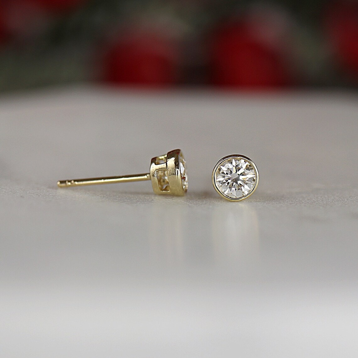diamond earrings in bezel setting with gold
