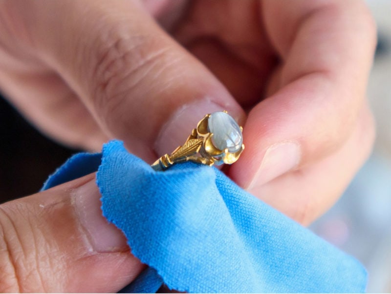 holding a gold ring by cashforgoldusa