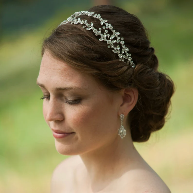 a woman wearing a crystal double vine diadem tiara