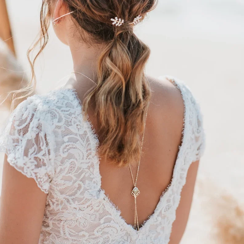 a bride wearing dainty backdrop necklace