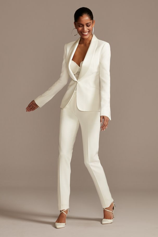 a woman wearing fitted satin shawl pant suit