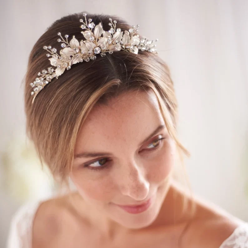 a bride wearing a floral wedding tiara