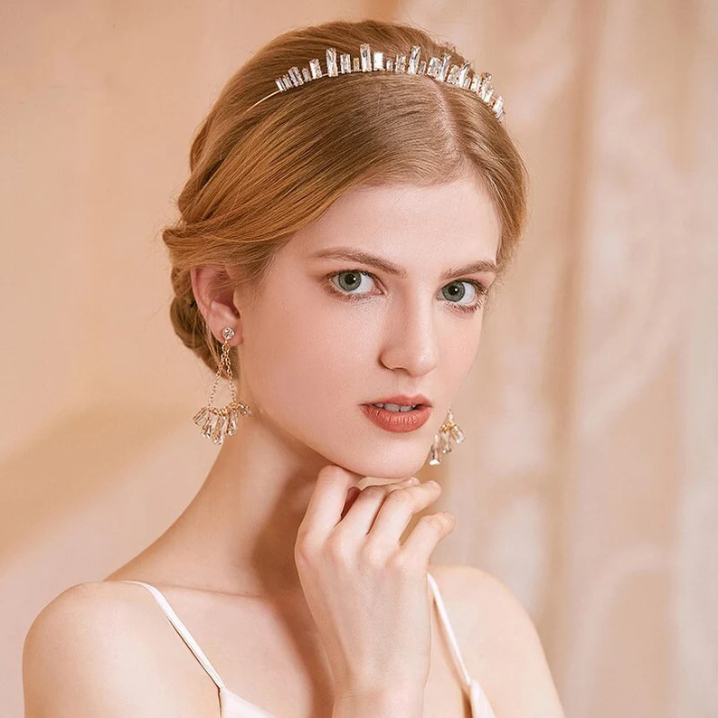 a girl wearing simple diamond tiara earring set