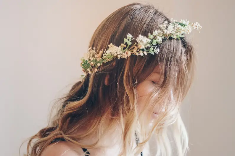 whimsical forest herbs flower crown on a woman's head