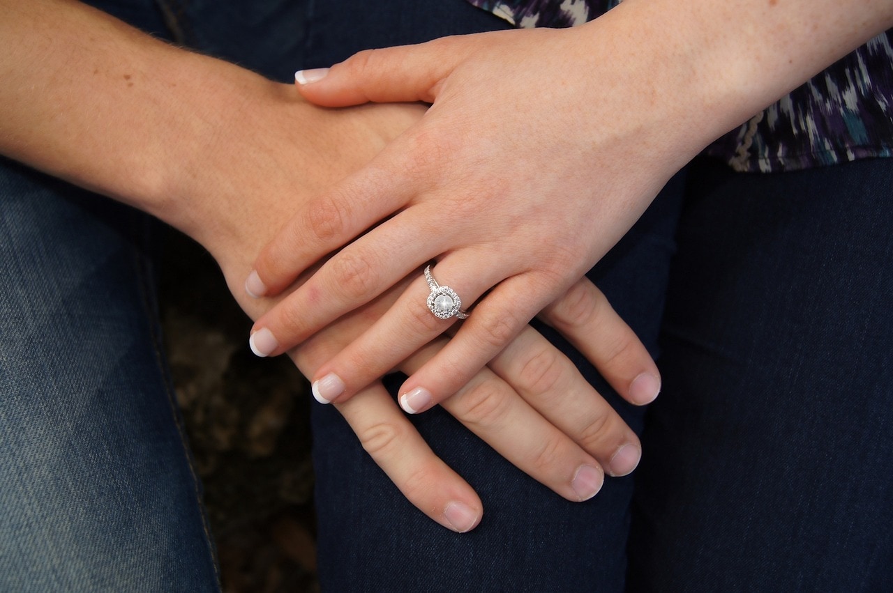 a hand with 4 Carat Diamond Engagement Ring