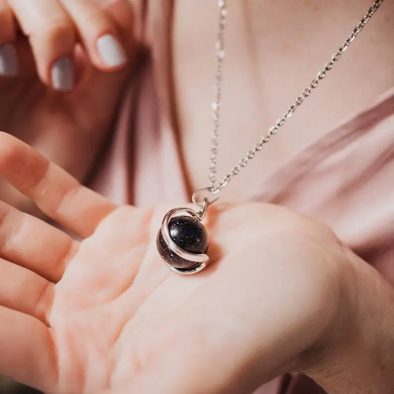 black aventurine necklace on the palm