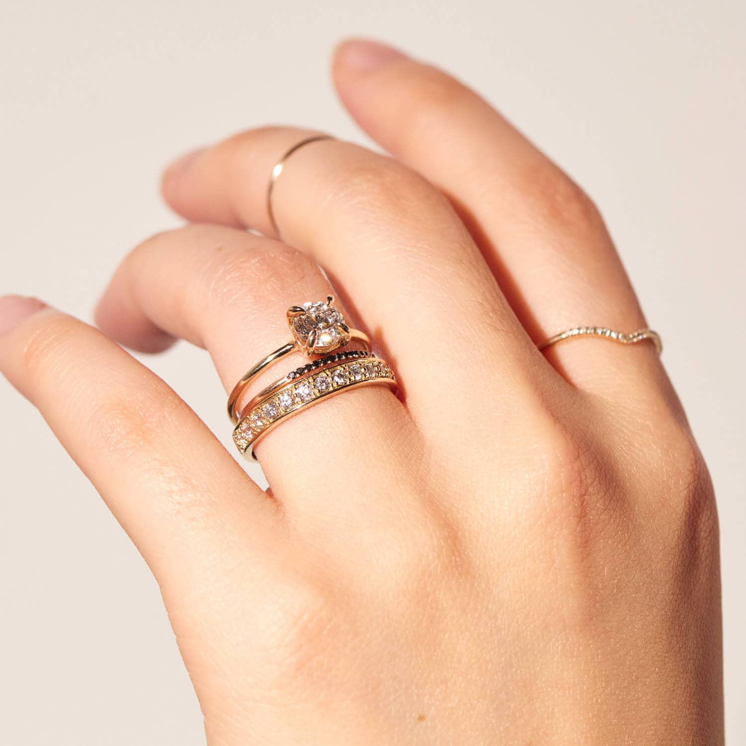 fingers with rings and diamond halfway band