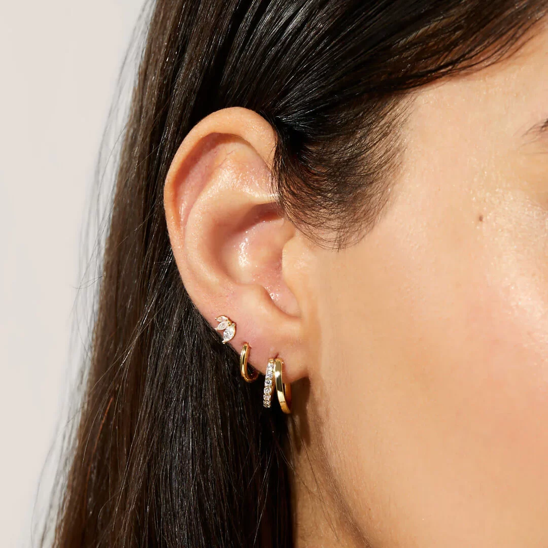 a woman wearing analuisa signature earrings bundle