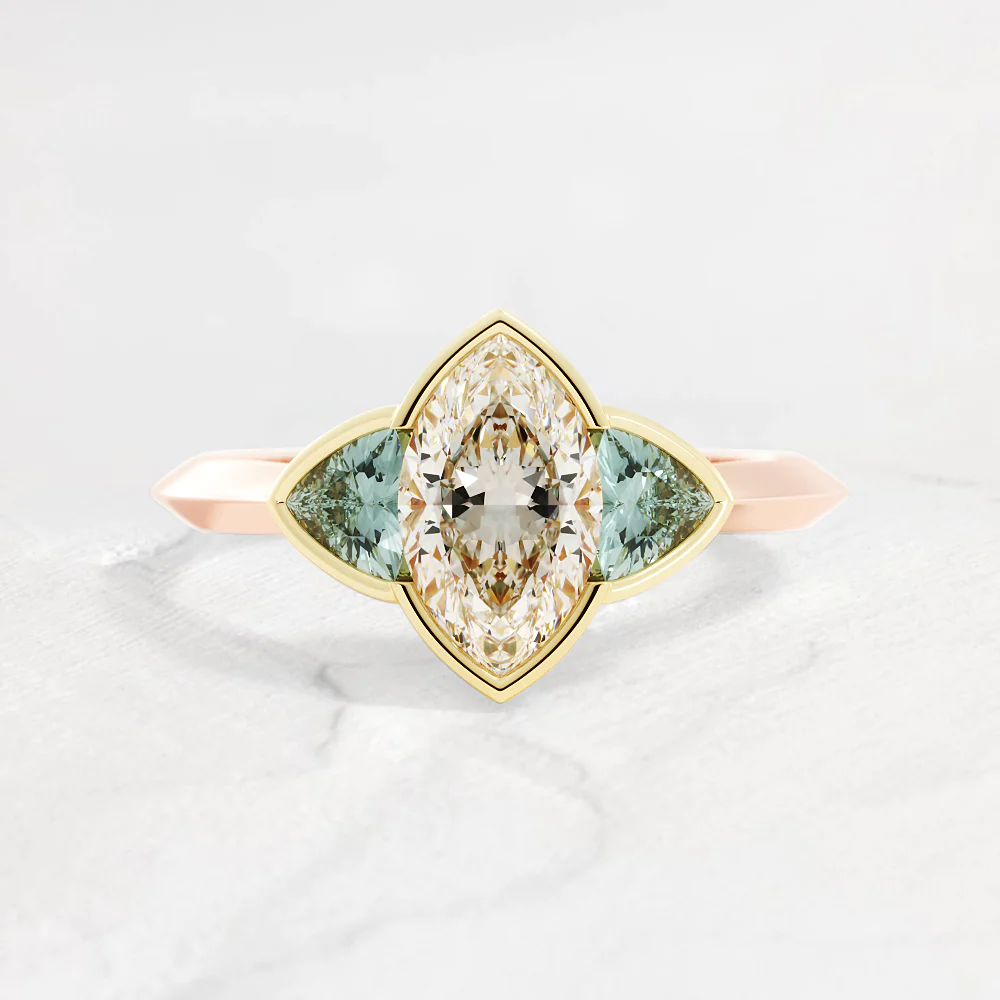 a ring with colorless diamond and green side diamonds
