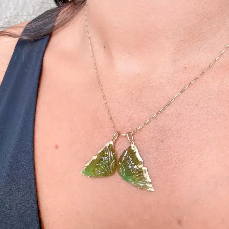 transvaal jade butterfly wing pendant on a woman's neck