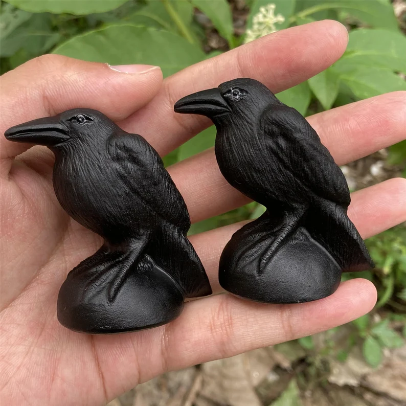 black obsidian crow sculptures