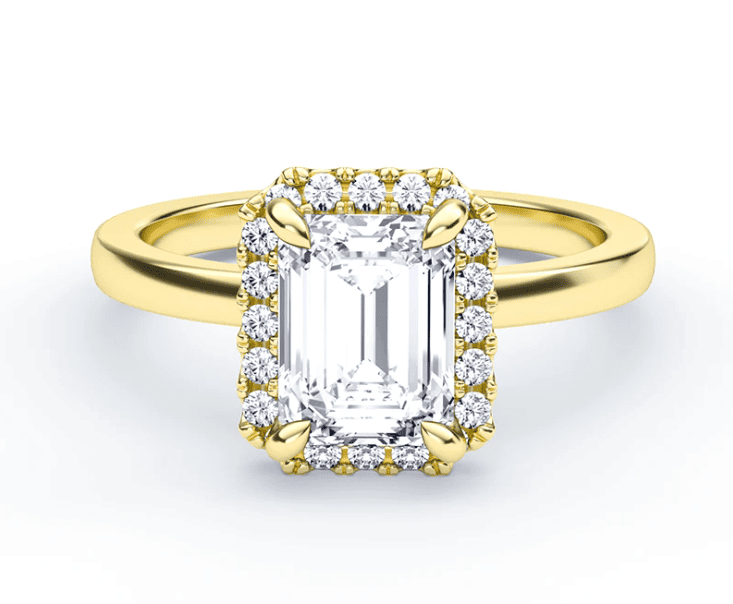 emerald cut halo diamond ring in yellow gold setting