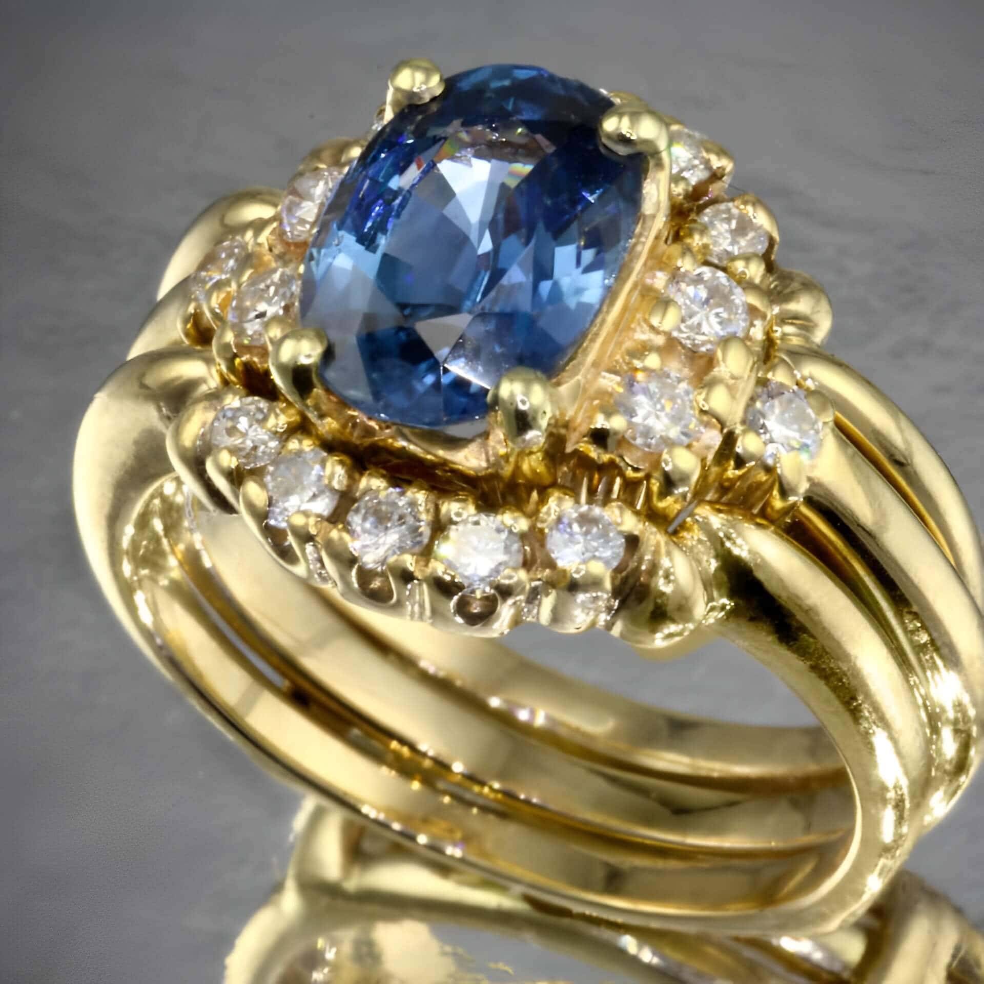 blue sapphire engagement ring in yellow gold setting