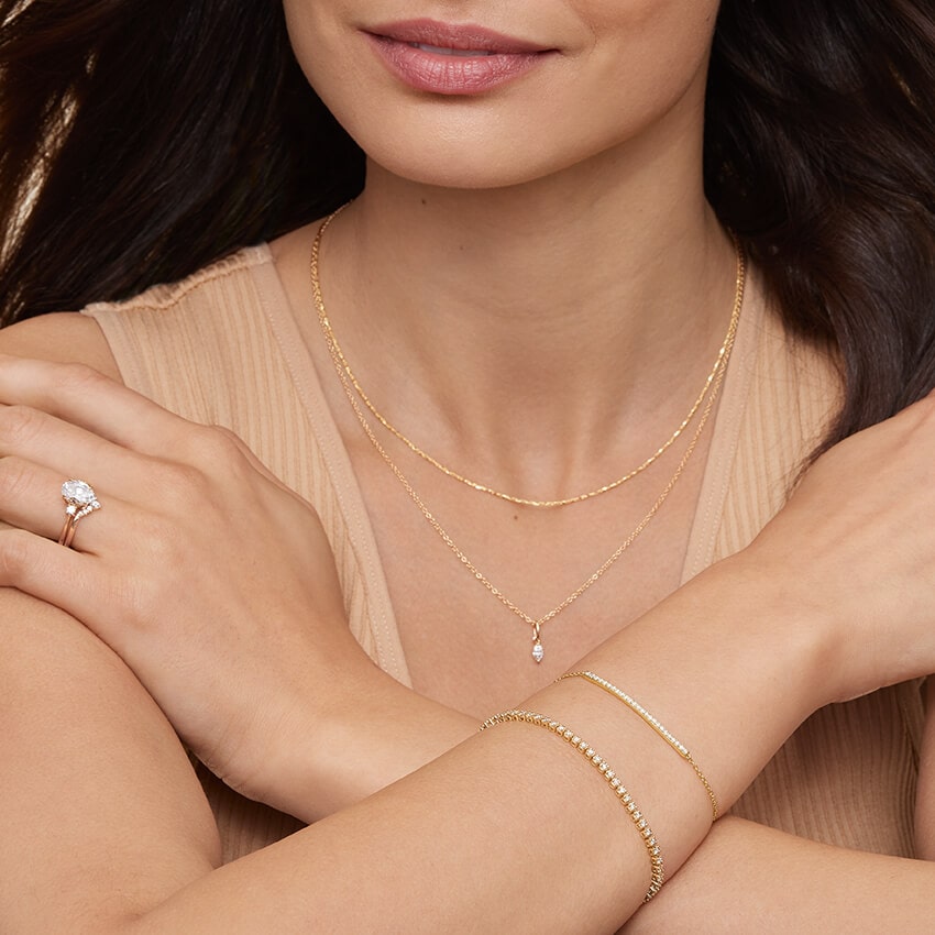 a woman wearing gold diamond jewelries