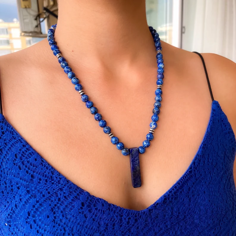 lapis lazuli beaded necklace on the woman's neck