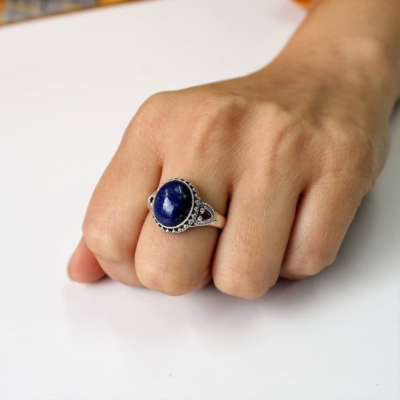 lapis lazuli sterling silver ring on the middle finger
