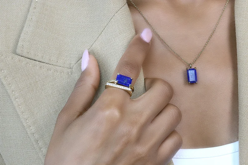 a woman wearing lapis lazuli wedding ring and necklace