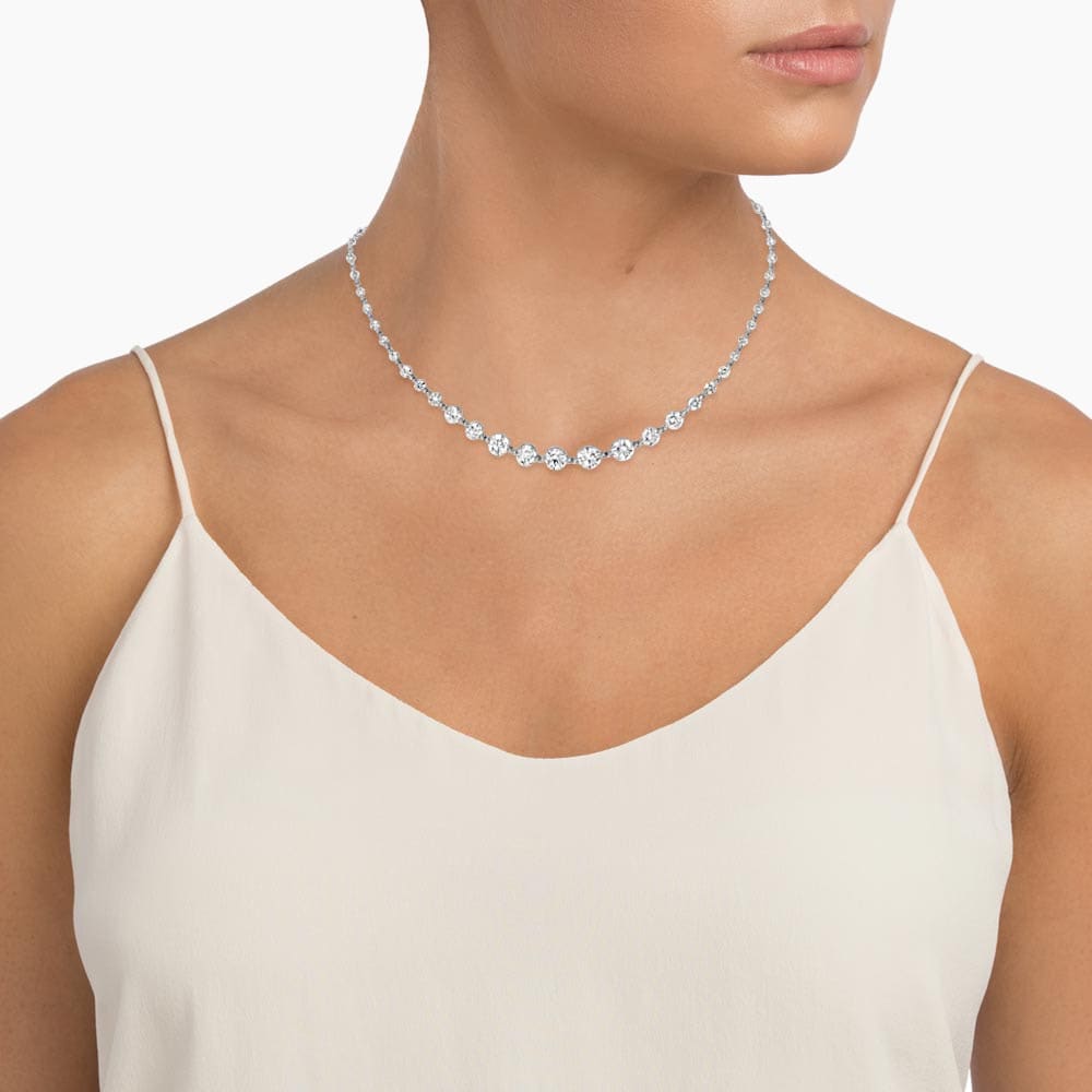 a riviere necklace on a woman's neck
