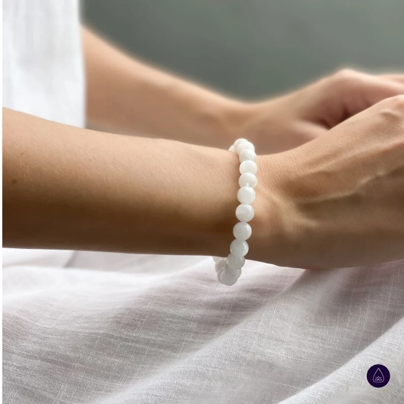 moonstone beaded bracelet on the woman's wrist