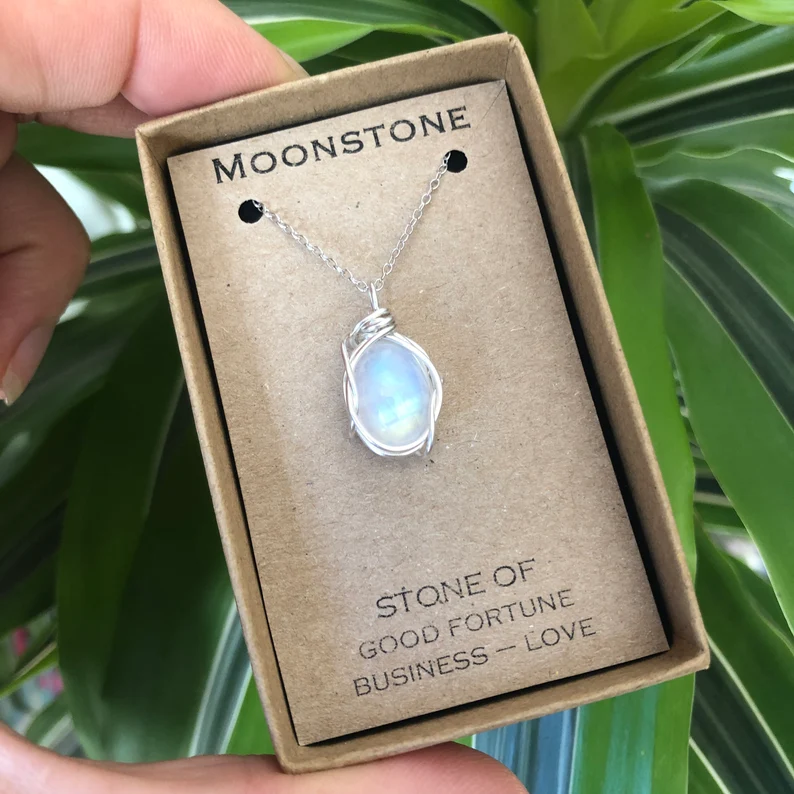 moonstone flash necklace on a jewelry box