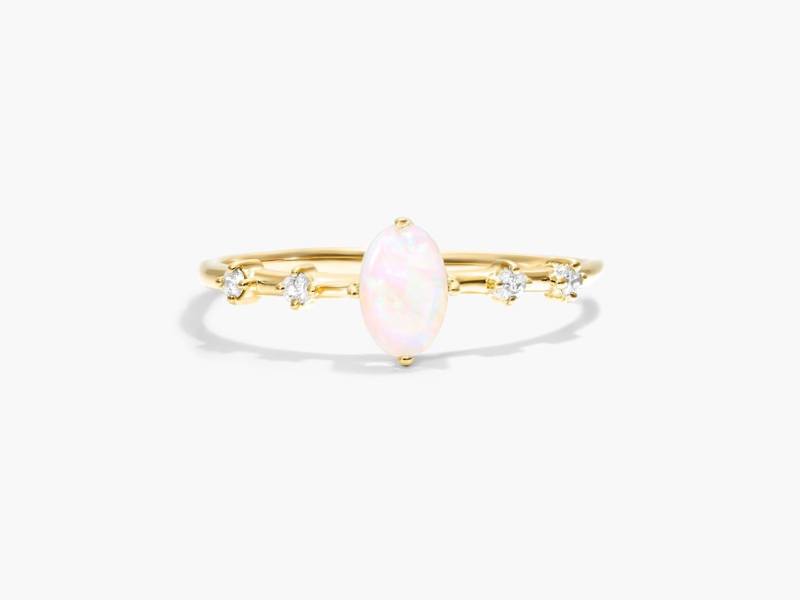 opal and diamond ring in yellow gold setting