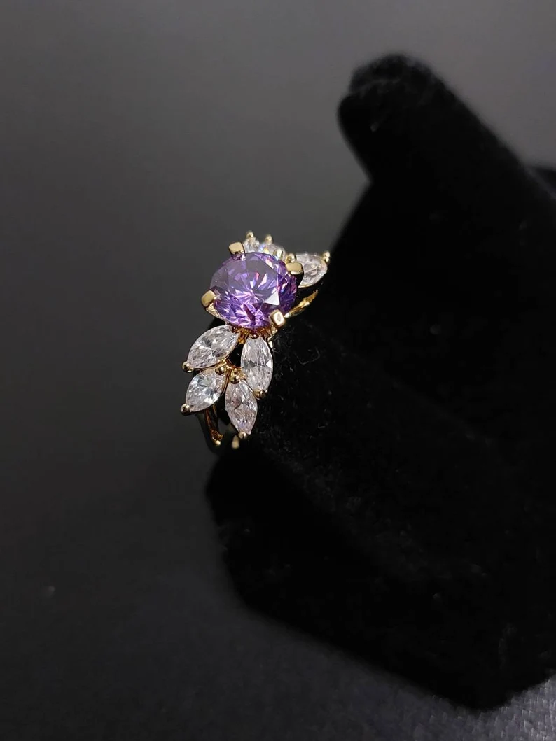 purple sapphire winged ring