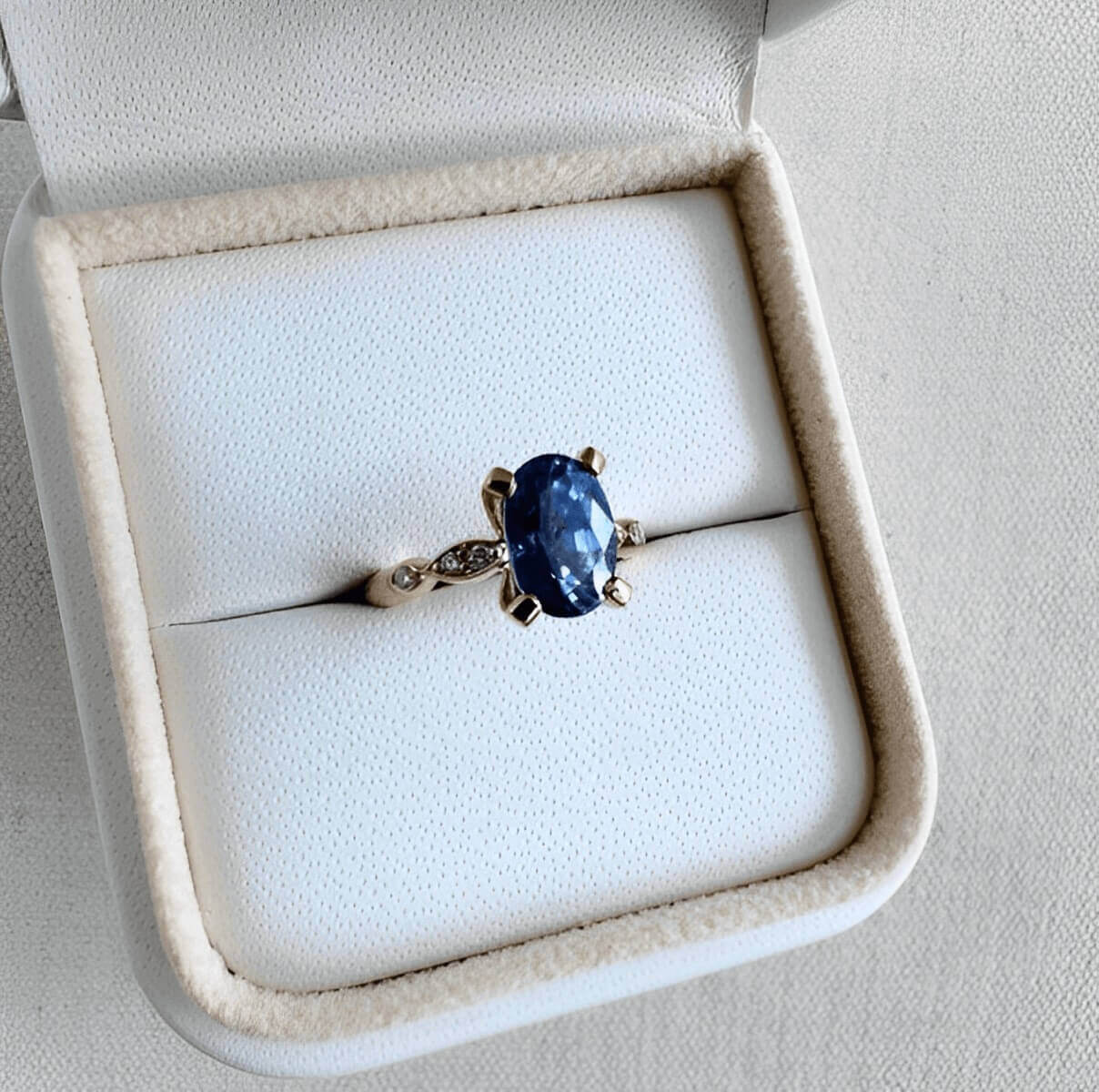 sapphire engagement ring in a jewelry box