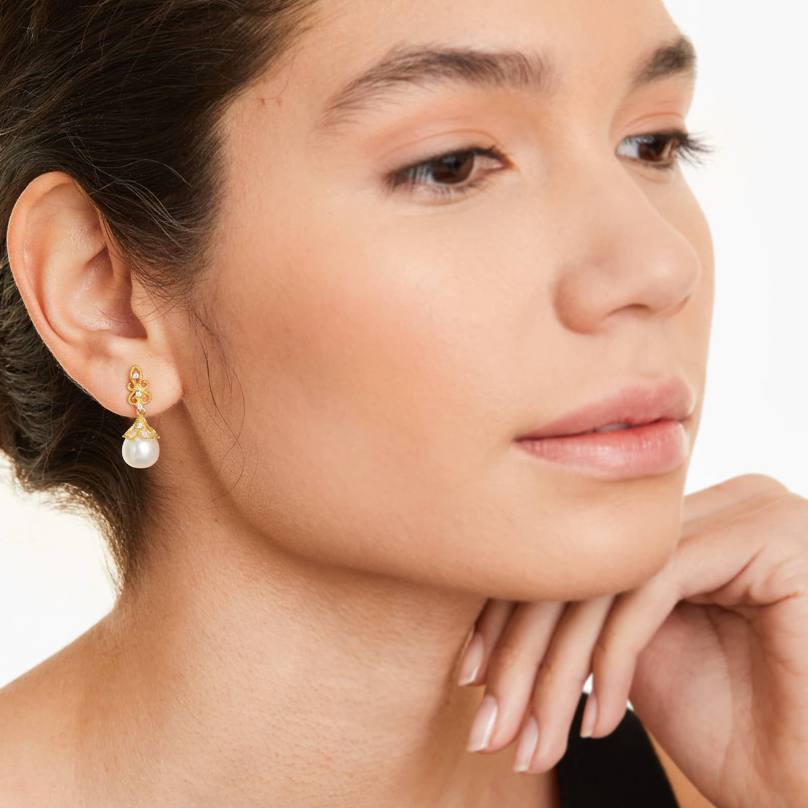 a woman wearing vintage inspired freshwater pearl drop earrings