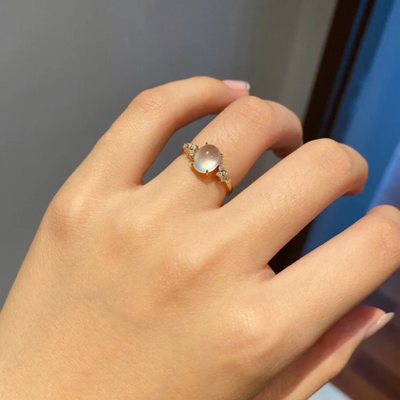 vintage moonstone ring on the ring finger