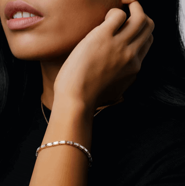 baguette diamond tennis bracelet on the woman's wrist