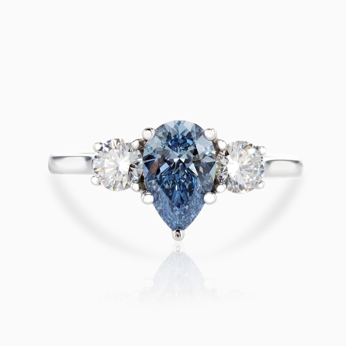 blue diamond three stone engagement ring