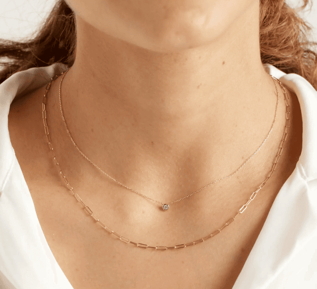 diamond bezel and clip necklaces on the woman's neck