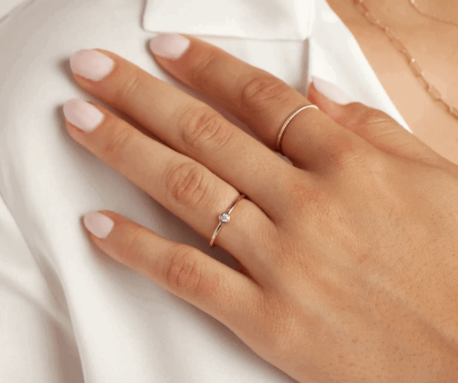 diamond bezel ring on the ring finger