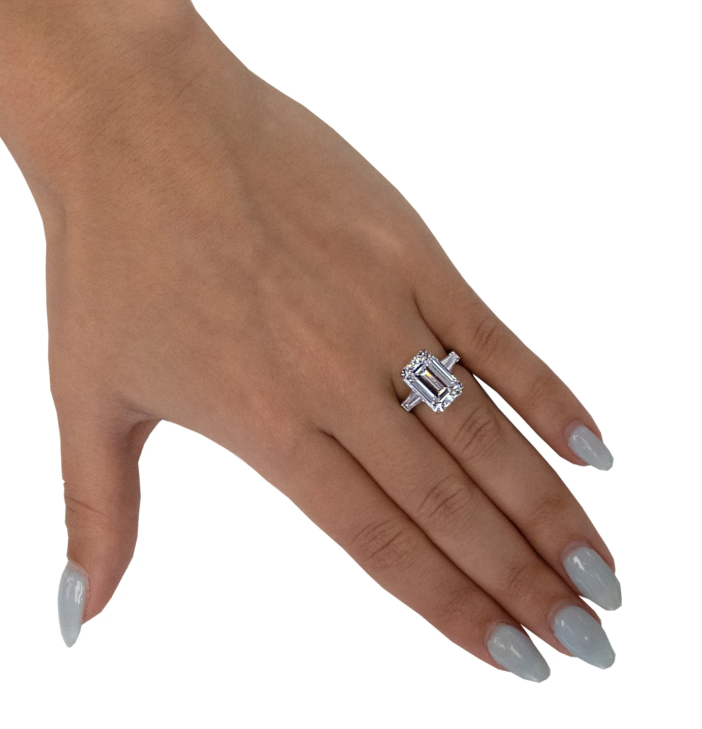 emerald cut diamond engagement ring on the ring finger